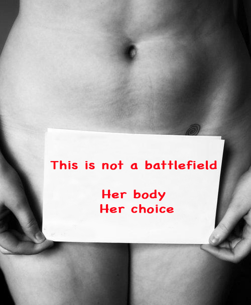 a woman with a sign over her womanhood which says her body is not a battlefield but her choice | www.imjussayin.com